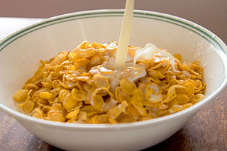 Cornflakes with milk pouring in.jpg